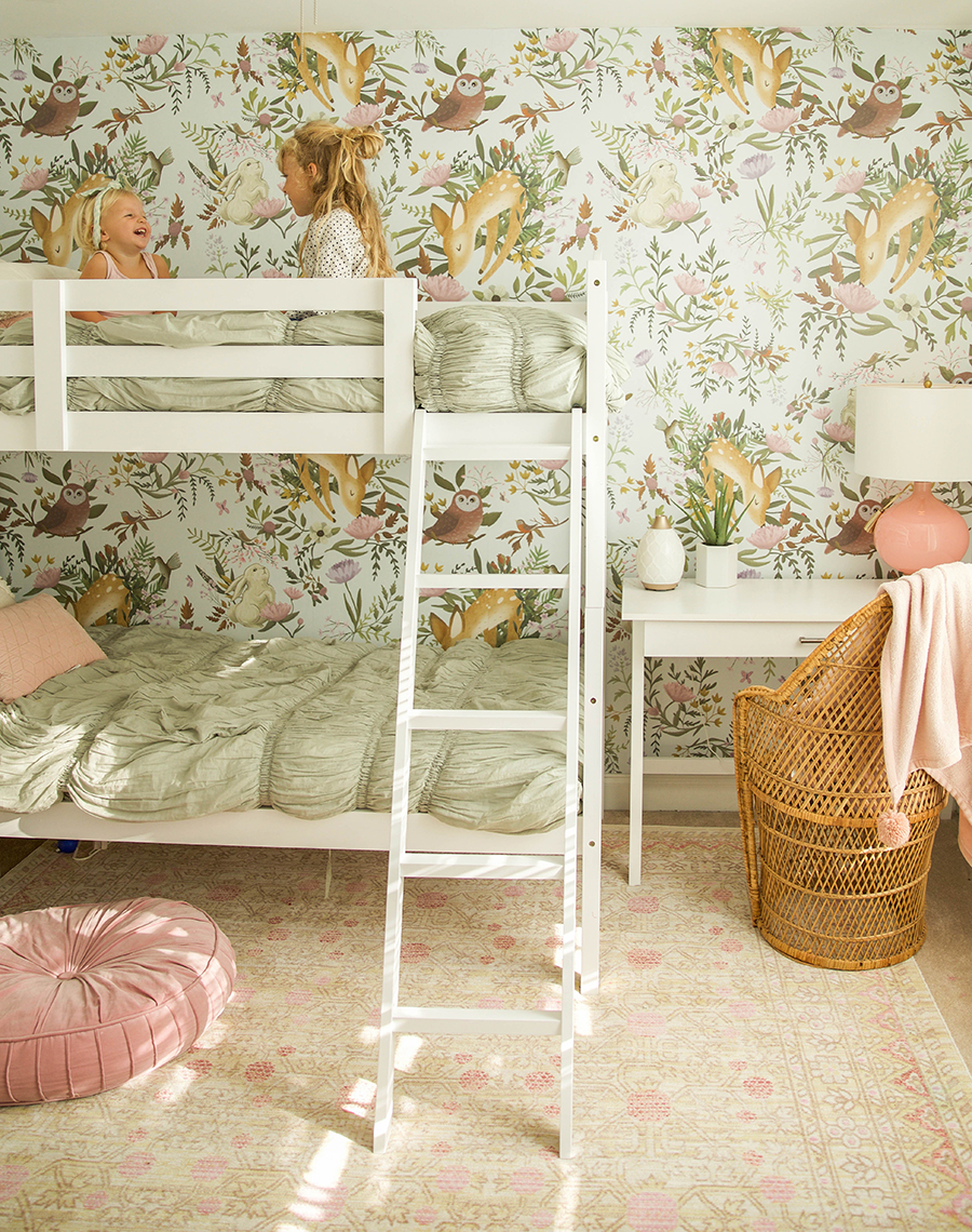 two bunk beds in small room