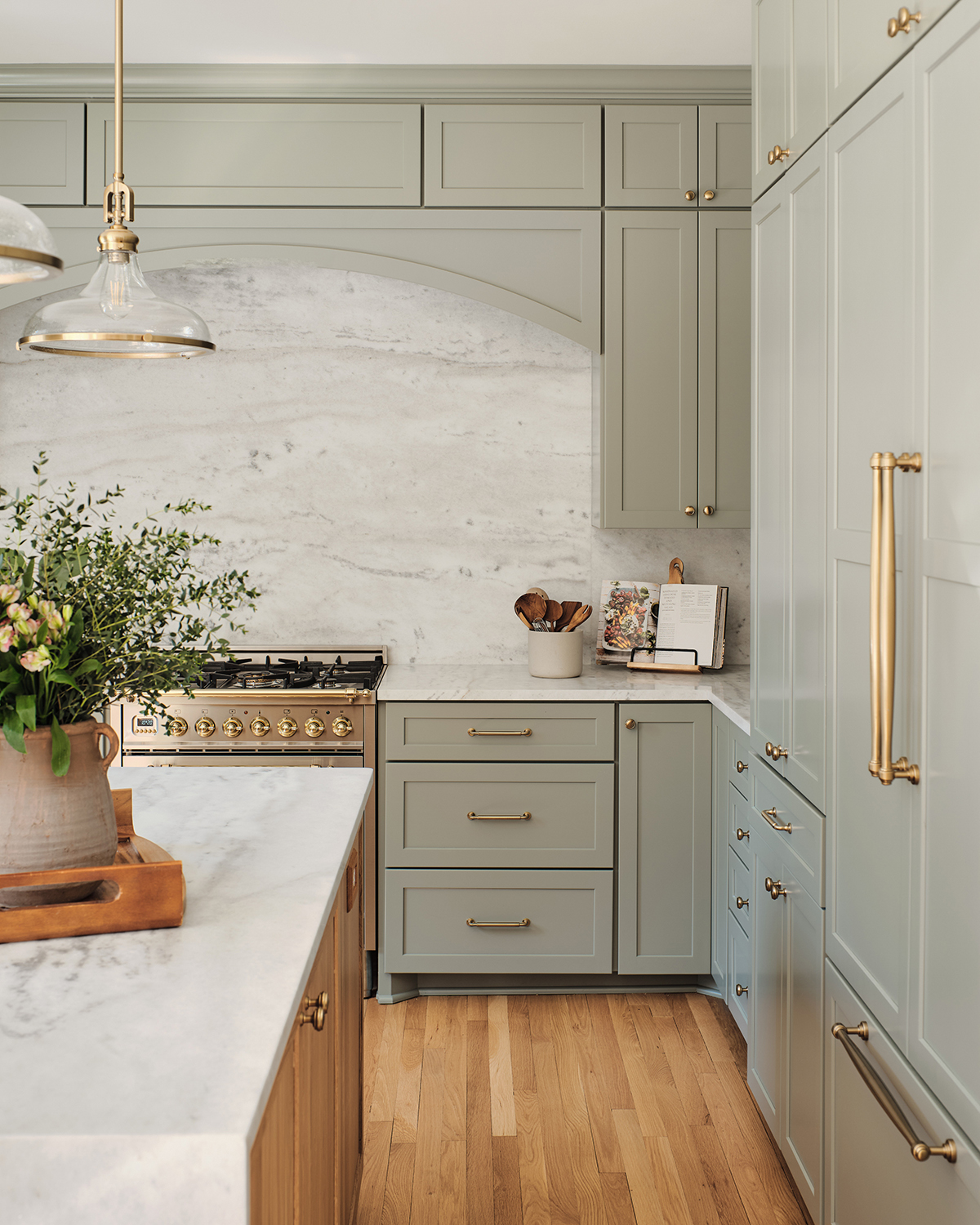 marble backsplash - green kitchen cabinets