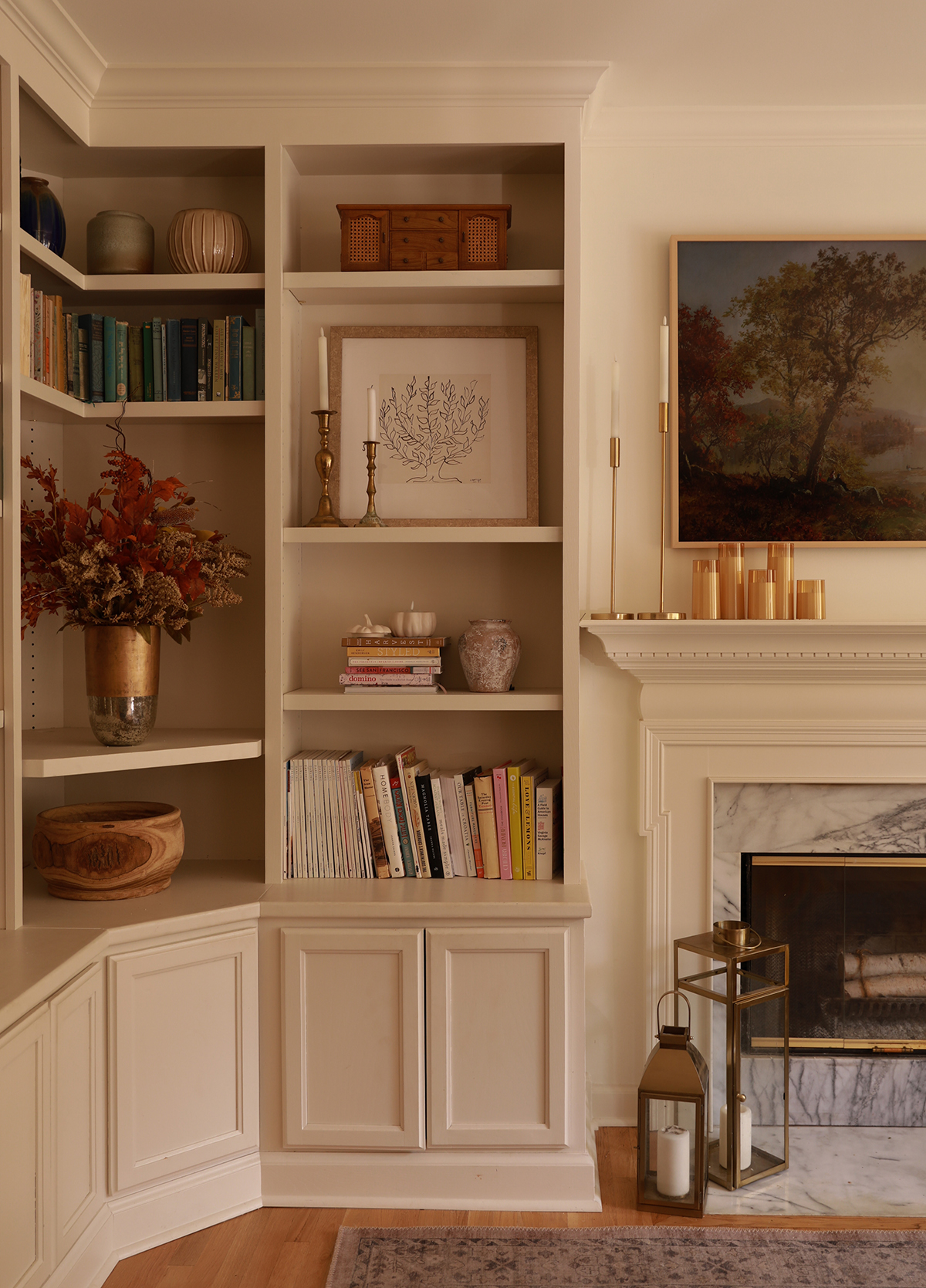 adding crown molding to bookshelves - fall decor - candles - faux branches