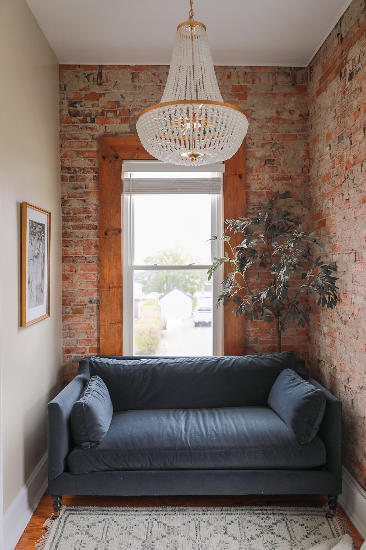 italianate brick home - chandelier velvet loveseat